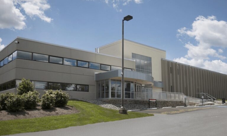 Front view of the Cherry Hill Campus on a clear day